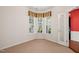 Cozy room with neutral carpet, bay window, and view into the home's main areas at 340 Orbison Dr, Cary, NC 27519