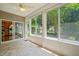 Bright and airy sunroom with ceiling fan and slider door at 340 Orbison Dr, Cary, NC 27519