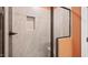 Modern tile shower with a built-in niche and a glass door, offering a sleek and contemporary design at 348 Church St # 51, Wendell, NC 27591