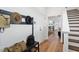 Welcoming entryway with coat rack, bench, and hardwood floors, leading to the main living areas at 352 Church St # 53, Wendell, NC 27591