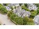An aerial view of a lovely home with trees in the yard and other houses nearby at 3923 Napa Valley Dr, Raleigh, NC 27612