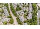 An aerial shot captures the neighborhood's houses and curving streets with mature trees at 3923 Napa Valley Dr, Raleigh, NC 27612
