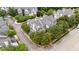 An aerial view of a home surrounded by mature trees, showing the roof and nearby street at 3923 Napa Valley Dr, Raleigh, NC 27612
