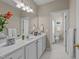 Bright bathroom with white cabinets and tile at 3923 Napa Valley Dr, Raleigh, NC 27612