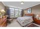 Cozy bedroom with large windows, chair, and dresser at 3923 Napa Valley Dr, Raleigh, NC 27612