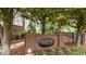 Entrance to Bentley Ridge at The Vineyard, featuring a brick sign with black iron fence and mature trees at 3923 Napa Valley Dr, Raleigh, NC 27612