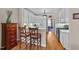 Bright kitchen offering white cabinets and a breakfast bar with seating for two at 3923 Napa Valley Dr, Raleigh, NC 27612