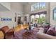Spacious living room featuring hardwood floors, a comfortable seating arrangement, and natural light at 3923 Napa Valley Dr, Raleigh, NC 27612