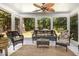Relaxing screened porch with wicker furniture, a ceiling fan, and views of the backyard at 4020 Gumleaf Dr, Apex, NC 27539