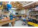 Unfinished basement area with workbench, shelves, storage, and work area at 4144 Fairport Rd, Kittrell, NC 27544