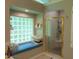Bright bathroom with a glass block window and shower with gold trim at 4144 Fairport Rd, Kittrell, NC 27544