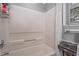 Clean bathroom featuring a tub-shower combination and storage shelves at 4144 Fairport Rd, Kittrell, NC 27544