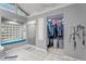 Bathroom area boasting glass block window, bench seat, walk-in shower, and open walk-in closet at 4144 Fairport Rd, Kittrell, NC 27544