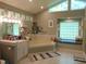 Bright bathroom with jacuzzi tub, vanity, and large window offers plenty of natural light at 4144 Fairport Rd, Kittrell, NC 27544