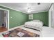 Large bedroom featuring tile floors, a ceiling fan, and window at 4144 Fairport Rd, Kittrell, NC 27544