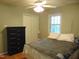 Bedroom with ceiling fan and neutral colors at 4144 Fairport Rd, Kittrell, NC 27544