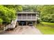 Unique home featuring a screened porch and convenient drive-under parking at 4144 Fairport Rd, Kittrell, NC 27544