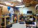 Spacious garage featuring a workbench, cabinets, lots of storage, and natural light at 4144 Fairport Rd, Kittrell, NC 27544