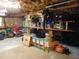 Spacious garage featuring parking space, various tools, lawn equipment and storage at 4144 Fairport Rd, Kittrell, NC 27544