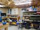 Spacious garage featuring a workbench, cabinets, and lots of storage at 4144 Fairport Rd, Kittrell, NC 27544