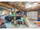 Garage featuring a car, work bench, storage boxes, and ladder at 4144 Fairport Rd, Kittrell, NC 27544