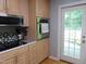 Well-appointed kitchen featuring stainless steel appliances, light wood cabinets, and access to the outdoors at 4144 Fairport Rd, Kittrell, NC 27544