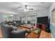 Spacious living room with sliding doors to porch and comfortable furnishings at 4144 Fairport Rd, Kittrell, NC 27544