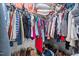 Large walk-in closet featuring ample hanging space, shelving and shoe storage at 4144 Fairport Rd, Kittrell, NC 27544