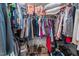 Spacious walk-in closet with ample hanging and storage space, and shoe shelving at 4144 Fairport Rd, Kittrell, NC 27544