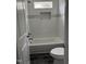 Bathroom featuring a subway tile shower with a decorative accent, a toilet and a tub at 431 Mayview Dr, Creedmoor, NC 27522