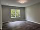 Bright, airy bedroom with modern light fixture and large windows at 431 Mayview Dr, Creedmoor, NC 27522
