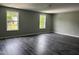 Bedroom showcasing luxury vinyl plank flooring, neutral walls, recessed lighting and two windows providing natural light at 431 Mayview Dr, Creedmoor, NC 27522