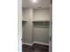 Walk-in closet featuring wooden floors, neutral walls and ample storage space with white shelves at 431 Mayview Dr, Creedmoor, NC 27522