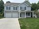 Charming two-story home with gray siding, blue shutters, and a two-car garage at 431 Mayview Dr, Creedmoor, NC 27522