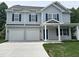 Charming two-story home with gray siding, blue shutters, and a two-car garage at 431 Mayview Dr, Creedmoor, NC 27522