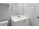 Bathroom with vanity, mirror, toilet, and shower with shower head and faucet fixtures at 4705 Walden Pond Dr # 110-C, Raleigh, NC 27604