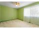 Well lit bedroom with a ceiling fan, large window, and plenty of space to personalize at 4705 Walden Pond Dr # 110-C, Raleigh, NC 27604