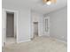 Spacious primary bedroom with neutral walls, carpet flooring, and walk in closet at 4705 Walden Pond Dr # 110-C, Raleigh, NC 27604