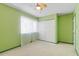 Comfortable bedroom with ceiling fan, window, and closet to make your own peaceful oasis at 4705 Walden Pond Dr # 110-C, Raleigh, NC 27604