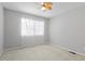Light-filled bedroom with neutral walls and carpet flooring, and natural light at 4705 Walden Pond Dr # 110-C, Raleigh, NC 27604