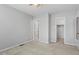Bright bedroom features neutral walls, ceiling fan, and access to closet and adjoining room at 4705 Walden Pond Dr # 110-C, Raleigh, NC 27604