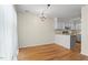 Bright dining area with hardwood floors and open access to kitchen and living room at 4705 Walden Pond Dr # 110-C, Raleigh, NC 27604