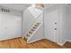 Bright entryway with hardwood floors, staircase, and ample closet space at 4705 Walden Pond Dr # 110-C, Raleigh, NC 27604