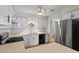 Traditional kitchen features painted cabinets, ceiling fan and stainless steel appliances at 4705 Walden Pond Dr # 110-C, Raleigh, NC 27604