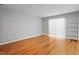 Spacious living room featuring hardwood floors and a sliding glass door at 4705 Walden Pond Dr # 110-C, Raleigh, NC 27604