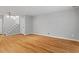 Spacious living room with hardwood floors, neutral walls, and staircase access at 4705 Walden Pond Dr # 110-C, Raleigh, NC 27604