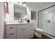Modern bathroom with a sleek vanity, stylish mirror, and glass-enclosed shower, offering a spa-like experience at 500 Grigsby Ave, Holly Springs, NC 27540