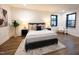 Serene bedroom with large bed, bedside tables, and natural light at 500 Grigsby Ave, Holly Springs, NC 27540