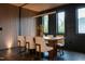 Elegant dining room featuring a stylish table, modern lighting, and scenic outdoor views at 500 Grigsby Ave, Holly Springs, NC 27540