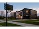 Modern, two-story home with a black and white facade, attached garage, and manicured lawn at 500 Grigsby Ave, Holly Springs, NC 27540